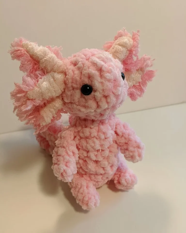 Crocheted axolotl amigurumi in vibrant colors, perfect for cuddling.