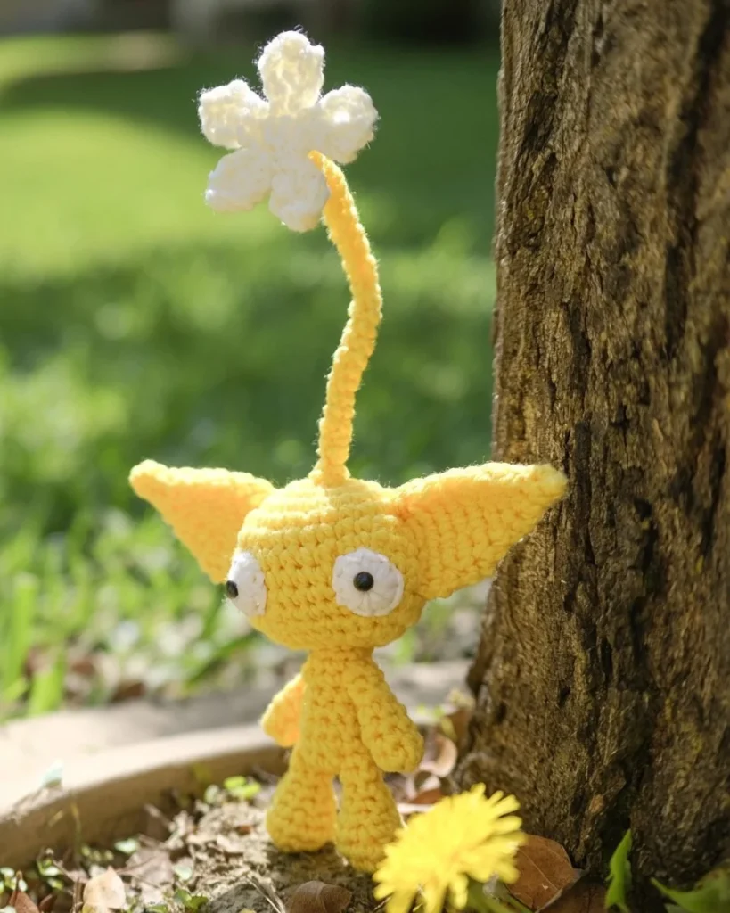 Cute Pikmin Amigurumi figures in vibrant colors and detailed stitching.