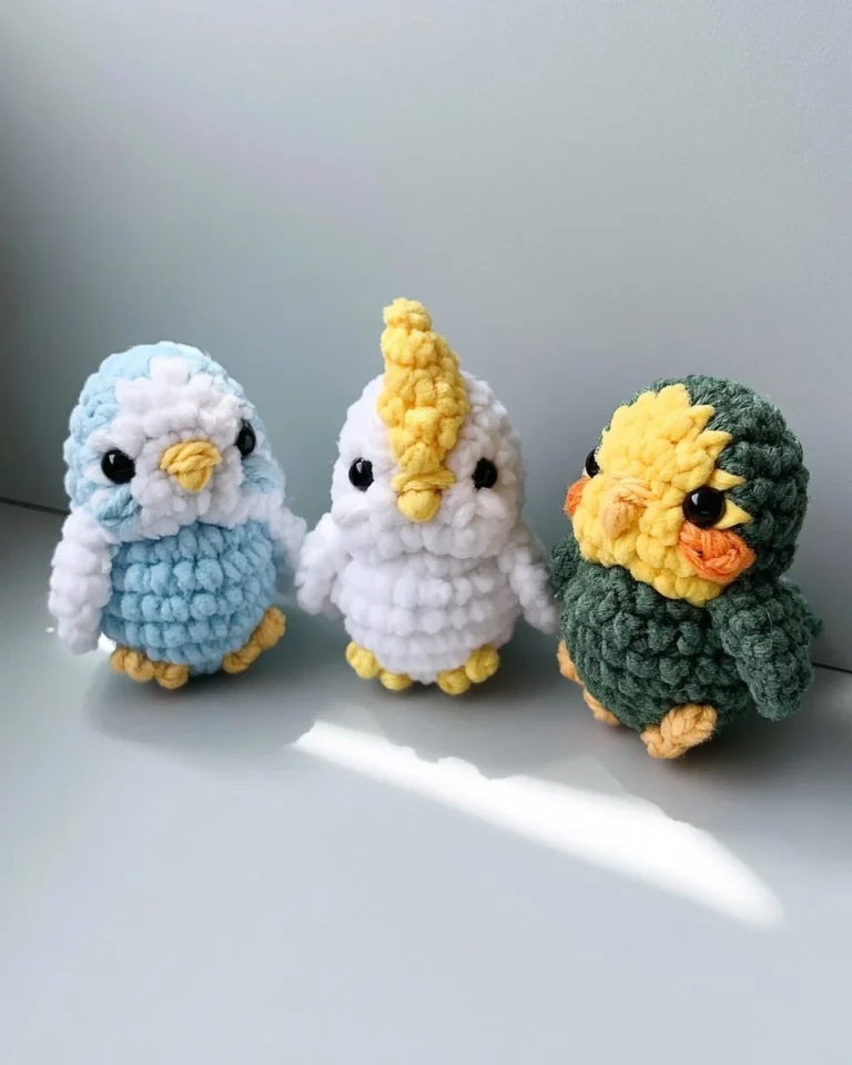 Colorful pocket parrots amigurumi crocheted toys on display